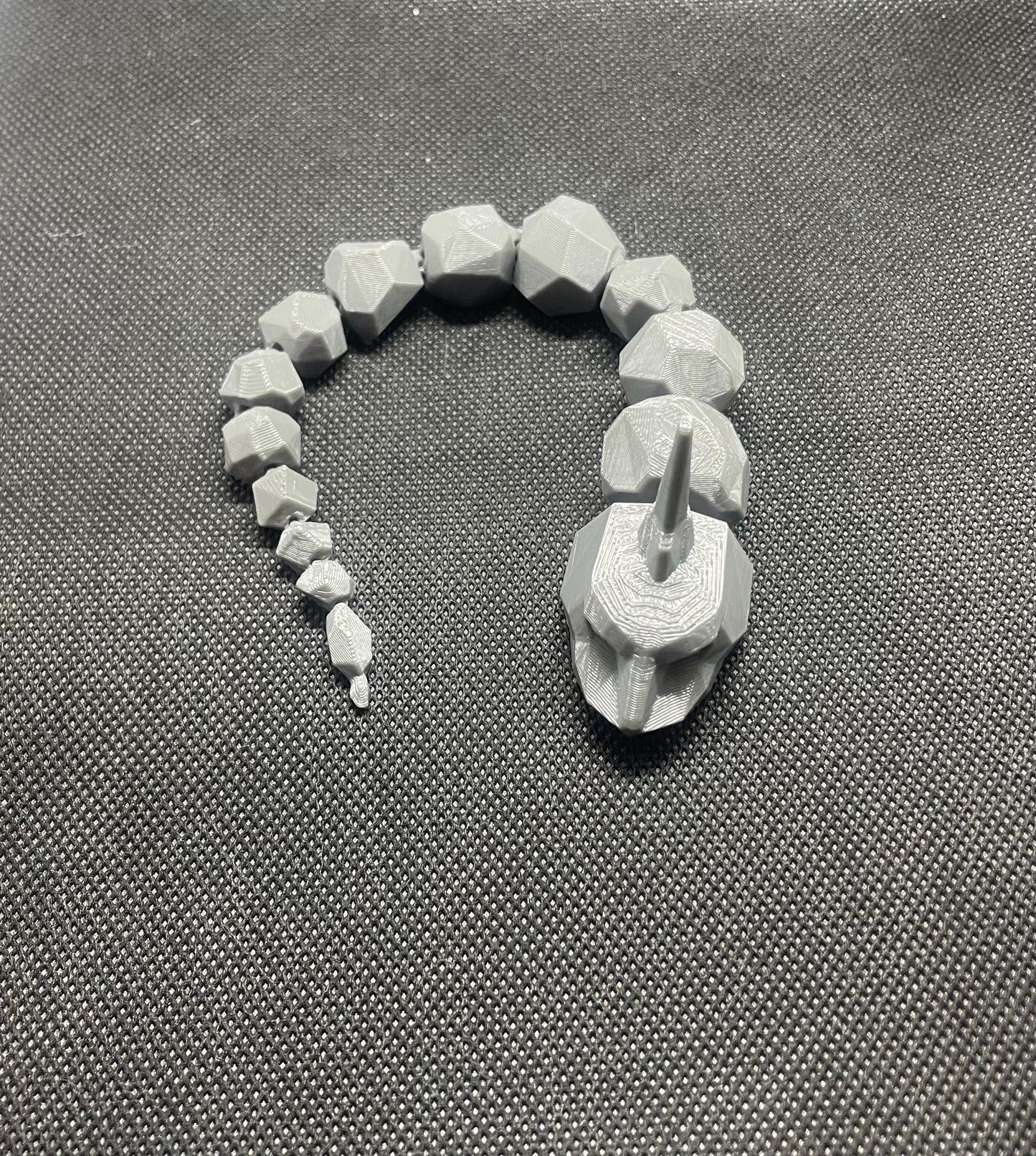 Articulating/flexible Onyx Pokemon fidget